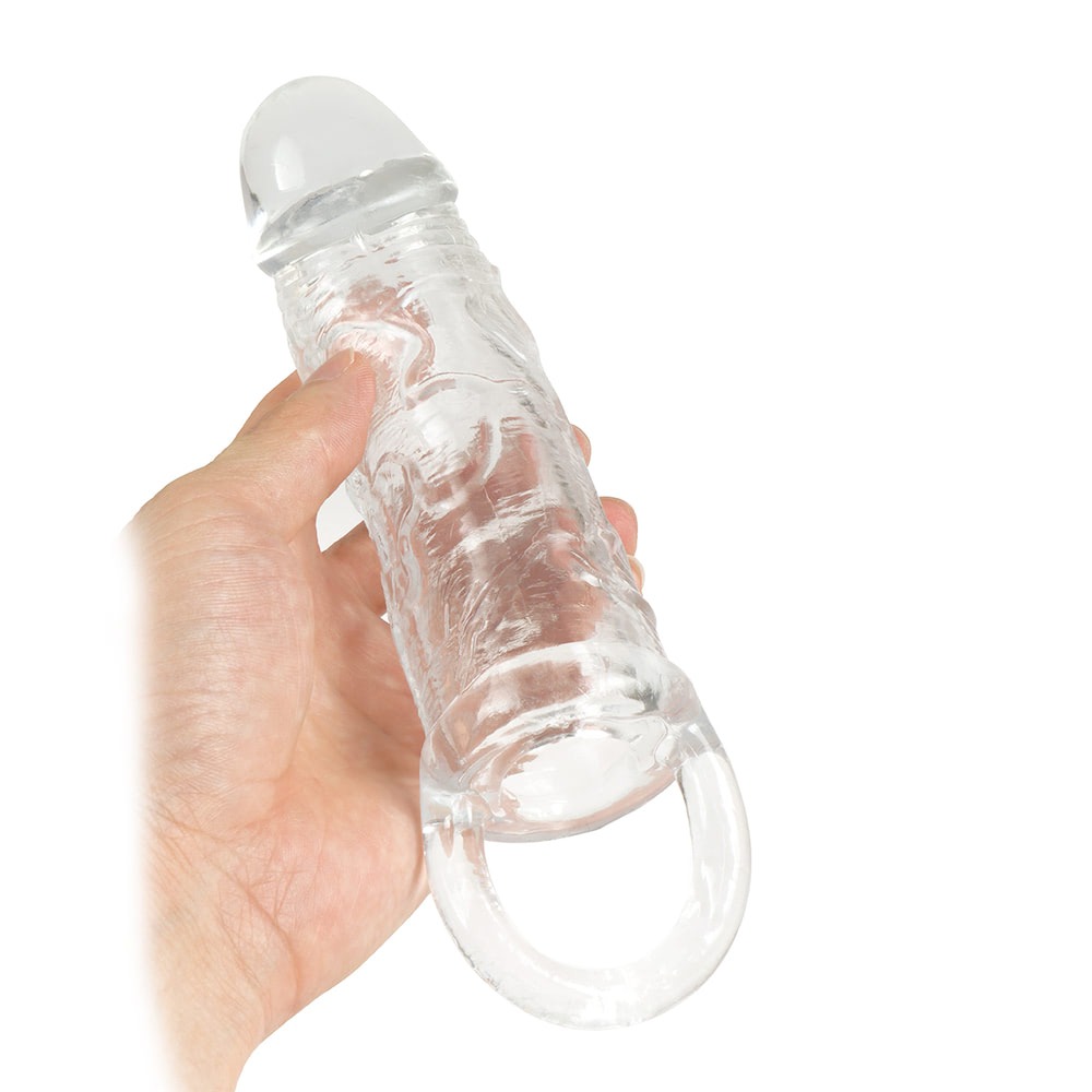 Capa Peniana com Alça para Testículo – Aumenta o Tamanho do Pênis – Retarda Ejaculação – Aumenta o Prazer da Parceira(o) – Material Silicone Macio Transparente – Super Elástica – 19,3cm x 4,1cm